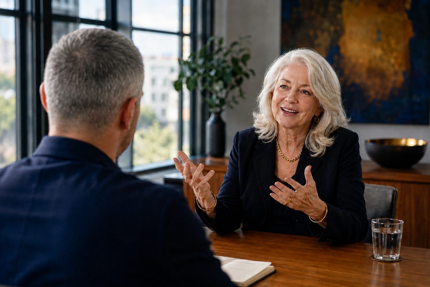 A capture session: a founder telling her story across the table from the interviewer, seen from behind